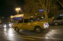 Russian flags are seen on a moving car in Sevastopol