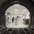 FILE - In this Dec. 6, 2012, photo, an employee walks through the appliance department at a Sears in North Olmsted, Ohio.  Sears posted a smaller loss in the fourth quarter as it reduced its inventory and expenses while sales at its namesake stores rose slightly.   (AP Photo/Mark Duncan, File)