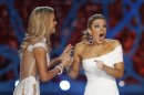 Miss New York, Mallory Hagan, right, reacts with Miss South Carolina Ali Rogers as she is crowned Miss America 2013 on Saturday, Jan. 12, 2013, in Las Vegas. (AP Photo/Isaac Brekken)