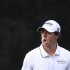 Rory McIlroy of Northern Ireland reacts after missing a putt on the thirteenth green during the first day of the Hong Kong Open golf tournament