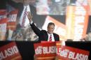 Liberal Democrat Bill de Blasio gestures as he walks onstage during his election victory party at the Park Slope Armory in New York