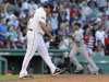 Boston Red Sox pitcher Vicente Padilla reacts as New York Yankees' Nick Swisher rounds the bases after hitting a grand slam during the seventh inning of American League MLB baseball action at Fenway Park in Boston
