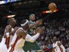 Boston Celtics forward Pierce drives to the basket as Miami Heat defenders Bosh, James and Wade pursue in the second half during their NBA basketball game in Miami