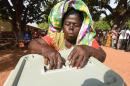 A woman casts her ballot for the presidential election at a polling station in Bole district, northern Ghana, on December 7, 2016