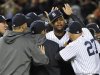 New York Yankees starting pitcher CC Sabathia (C) celebrates with teammates after the Yankees defeated the Baltimore Orioles in Game 5 of their MLB ALDS baseball playoff series in New York