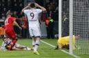 Bayern's Mario Goetze, bottom left, is comforted by Leverkusen's Omer Toprak from Turkey after he failed to score during the German soccer cup (DFB Pokal) quarterfinal match between Bayer 04 Leverkusen and Bayern Munich Wednesday, April 8, 2015 in Leverkusen, Germany. (AP Photo/Frank Augstein)