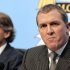 Manchester City manager Roberto Mancini looks on as Garry Cook (right) speaks during a press conference in Manchester
