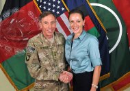 This July 13, 2011, photo made available on the International Security Assistance Force's Flickr website shows the former Commander of International Security Assistance Force and U.S. Forces-Afghanistan Gen. Davis Petraeus, left, shaking hands with Paula Broadwell, co-author of "All In: The Education of General David Petraeus."As details emerge about Petraeus' extramarital affair with his biographer, Broadwell, including a second woman who allegedly received threatening emails from the author, members of Congress say they want to know exactly when the now ex-CIA director and retired general popped up in the FBI inquiry, whether national security was compromised and why they weren't told sooner. (AP Photo/ISAF)