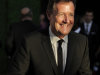 FILE - In this July 9, 2011 file photo, Piers Morgan arrives at the inaugural BAFTA Brits to Watch 2011 event at the Belasco Theater in Los Angeles. No one suspected the secretary. Efficient, well-dressed and well-liked, Sue Harris was at the heart of the Sunday People, the smallest of Britain's weekly tabloids. In 1995 Harris was dismissed over an allegation that she'd been feeding her paper's juiciest scoops to Piers Morgan's News of the World, betraying her co-workers for a weekly payoff of 250 pounds - then worth about $375. Although People journalists had long believed there was a traitor in their midst, they were shocked when Harris was exposed. (AP Photo/Chris Pizzello, File)
