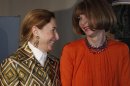 American Vogue's editor-in-chief Anna Wintour, right, talks to Italian fashion designer Miuccia Prada during the presentation of the fashion exhibition 