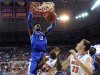 Kentucky forward Nerlens Noel (3) dunks as Florida's Casey Prather (24) and Erik Murphy (33) watch during the first half of an NCAA college basketball game in Gainesville, Fla., Tuesday, Feb. 12, 2013. Florida won 69-52. (AP Photo/Phil Sandlin)