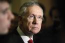Reid answers questions from reporters after the weekly Republican caucus luncheon at the U.S. Capitol in Washington