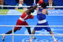 Azerbaijan's Rufat Huseynov (R) fights Namibia's Mathias Tulyoongeleni Hamunyela during the men's light fly (46-49kg) match on August 6, 2016