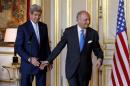 French Foreign Minister Laurent Fabius escorts US Secretary of State John Kerry after their talks and statement at the Quai d'Orsay Foreign Affairs ministry in Paris
