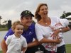 Justin Rose, of England, poses with his family and the Gene Sarazen Cup for after he won the Cadillac Championship golf tournament on Sunday, March 11, 2012, in Doral, Fla. To the left is Leo, 3; to the right his wife, Charlotte, holding 2-month-old Kate. (AP Photo/Wilfredo Lee)