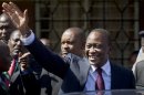 Kenya's President-Elect Uhuru Kenyatta waves to supporters after leaving the National Election Center where final election results were announced declaring he would be the country's next president, in Nairobi, Kenya, Saturday, March 9, 2013. (AP Photo/Ben Curtis)