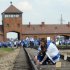 Young Jews place memory plaques on railway tracks at the Auschwitz-Birkenau Nazi death camp in April
