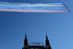 Russian warplanes fly above Red Square during a Victory …