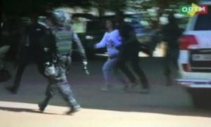 Still image from video show a hostage rushed out from the Radisson hotel in Bamako, Mali