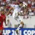United States' Dempsey takes a shot on goal near Panama's Torres during CONCACAF Gold Cup soccer match in Tampa