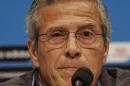 Uruguay's head coach Oscar Tabarez makes a statement during a press conference the day before the round of 16 World Cup soccer match between Colombia and Uruguay at the Maracana Stadium in Rio de Janeiro, Brazil, Friday, June 27, 2014. FIFA banned Uruguay striker Luis Suarez from all football activities for four months on Thursday for biting an opponent at the World Cup, a punishment that rules him out of the rest of the tournament and the start of the upcoming Premier League season. (AP Photo/Matt Dunham)