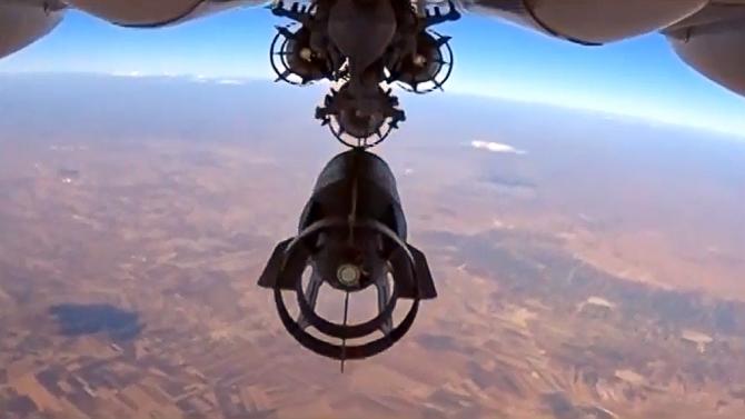 A bomb is dropped from a Russian Su-24M bomber during an airstrike in Syria in this image taken from video on the Russian Defence Ministry's website on October 5, 2015