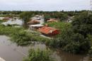 Houses are seen partially submerged in floodwaters in Asuncion