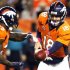 Denver Broncos running back Willis McGahee takes a handoff from Denver quarterback Peyton Manning against the New Orleans Saints in the first quarter of their NFL football game in Denver