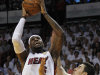 Miami Heat small forward LeBron James (6) shoots against Oklahoma City Thunder power forward Nick Collison (4) during the first half of Game 4 of the NBA Finals basketball series, Tuesday, June 19, 2012, in Miami.  (AP Photo/Lynne Sladky)