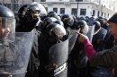 Tunisian protesters clash with riot police during demonstration after death of Tunisian opposition leader Belaid, outside Interior ministry in Tunis