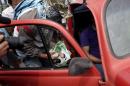 A masked man seized campaign materials of a car in a check point of the community in the entry of Tixtla, in the state of Guerrero