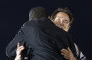 FILE - In this Nov. 2, 2008, file photo Bruce Springsteen hugs presidential candidate Barack Obama during a performance at an outdoor campaign rally at the Cleveland Mall, in Cleveland, Ohio. Springsteen is hitting the campaign trail again on President Barack Obama's behalf, and he'll be joined this time by former President Bill Clinton at a rally in Parma, Ohio, Thursday, Oct. 18, 2012. (AP Photo/Alex Brandon, File)