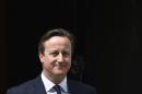 Britain's Prime Minister David Cameron waits to greet his Ukrainian counterpart Arseniy Yatsenyuk at Number 10 Downing Street in London