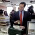 Republican presidential candidate, former Pennsylvania Sen. Rick Santorum, insists on paying for his lunch, Saturday, March 3, 2012, in Wilmington, Ohio.  (AP Photo/Eric Gay)