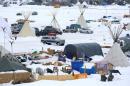Signs hang in the Dakota Access Pipeline protest camp on the edge of the Standing Rock Sioux Reservation near Cannon Ball