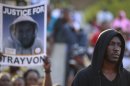 Residents take part in a rally demanding justice for the killing of black teenager Trayvon Martin in Miami