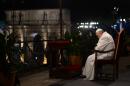 Pope Francis presides at the Way of the Cross torchlight procession at the Colosseum on Good Friday on April 3, 2015 in Rome
