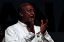 John Dramani Mahama, Ghana's president and National Democratic Congress (NDC) presidential candidate sings during his rally at Accra sport stadium