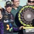 Denny Hamlin stands next to the trophy after winning the NASCAR Sprint Cup Series auto race at Phoenix International Raceway on Sunday, March 4, 2012, in Avondale, Ariz. (AP Photo/Paul Connors)