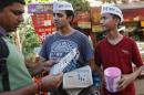 File picture shows volunteers of newly formed Aam Aadmi (Common Man) Party distributing newsletters in Delhi