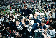 FILE - In this Jan. 2, 1987 file photo, Penn State coach Joe Paterno is carried off after defeating Miami, 14-10, in the Fiesta Bowl NCAA college football game to win the national championship, in Tempe, Ariz. On Sunday, Jan. 22, 2012, family says Paterno, winningest coach in major college football, has died. (AP Photo/Jim Gerberich, File)
