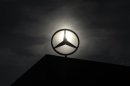 Logo of Mercedes Benz is seen on top of a car factory against the background of an overcast sky in the central Hungarian town of Kecskemet
