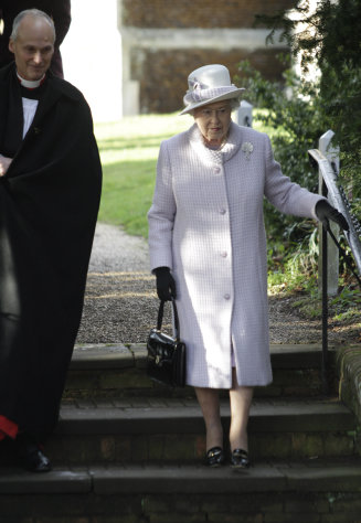Britain's Queen Elizabeth II, right, leaves after she and other members of the royal family attended a Christmas Service at St. Mary's church on the grounds of Sandringham Estate, the Queen's Norfolk retreat, England, Sunday, Dec. 25, 2011. (AP Photo/Lefteris Pitarakis)