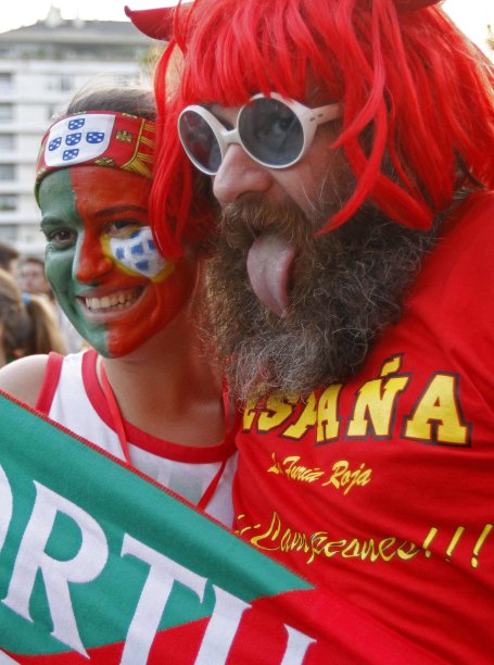 Soccer fans dressed with Portugal and Spain's colors pose prior Euro 2012 semi final soccer match in Lisbon