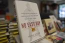 Copies of a book by a former Navy SEAL tittled "No Easy Day" are seen on display at a bookstore in Washington, DC