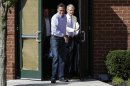 Republican presidential candidate and former Massachusetts Gov. Mitt Romney and Sen. Rob Portman, R-Ohio, emerge from debate preparation at a hotel in Columbus, Ohio, Saturday, Oct. 13, 2012. (AP Photo/Charles Dharapak)