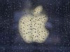 Raindrops are seen in front of an Apple logo outside an Apple store in Shanghai