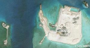 Center for Strategic and International Studies (CSIS) Asia Maritime Transparency Initiative image of the artificial island at the southern end of Mischief Reef showing a newly-built seawall on its north side and a completed dock