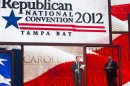 Republican National Committee Chairman Reince Priebus, left, and convention CEO William Harris unveil the stage and podium for the 2012 Republican National Convention, Monday, Aug. 20, 2012, at the Tampa Bay Times Forum in Tampa, Fla. (AP Photo/Scott Iskowitz)