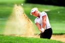 Brooke M. Henderson of Canada hits out of a bunker on the fifth hole during the third round of the LPGA Cambia Portland golf tournament in Portland, Ore., Saturday, Aug. 15, 2015. (AP Photo/Steve Dykes)